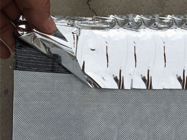 Self-adhesive polypropylene/polyester waterproofing membrane